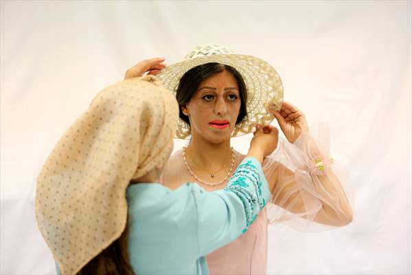 Acid attack victims model for Iranian fashion designer