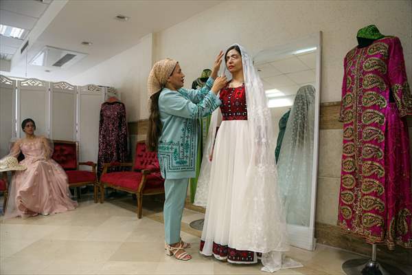Acid attack victims model for Iranian fashion designer