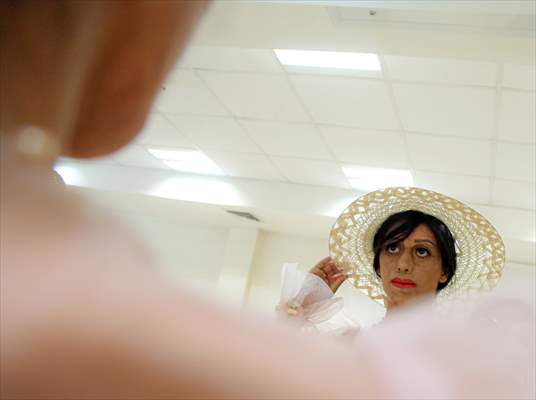 Acid attack victims model for Iranian fashion designer