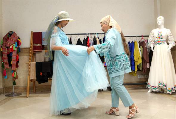 Acid attack victims model for Iranian fashion designer