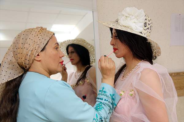 Acid attack victims model for Iranian fashion designer