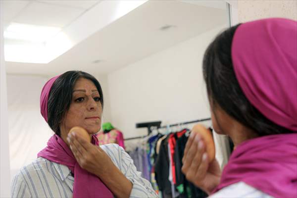Acid attack victims model for Iranian fashion designer