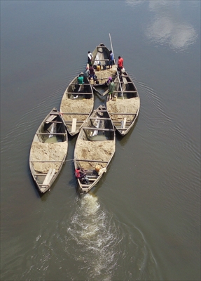 Cameroonian young people work under Sanaga River