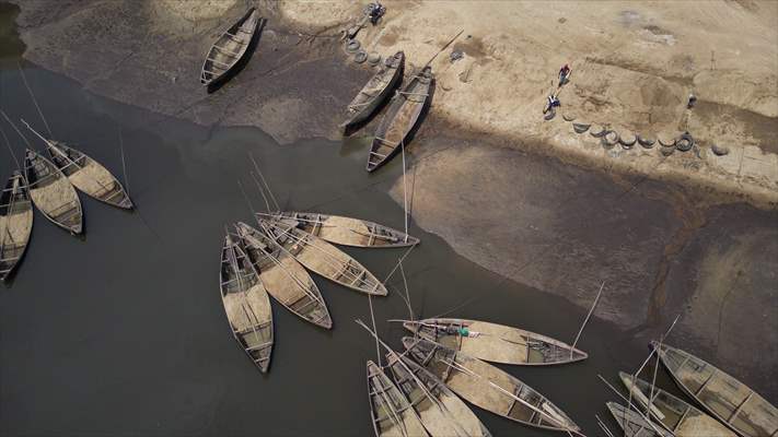 Cameroonian young people work under Sanaga River