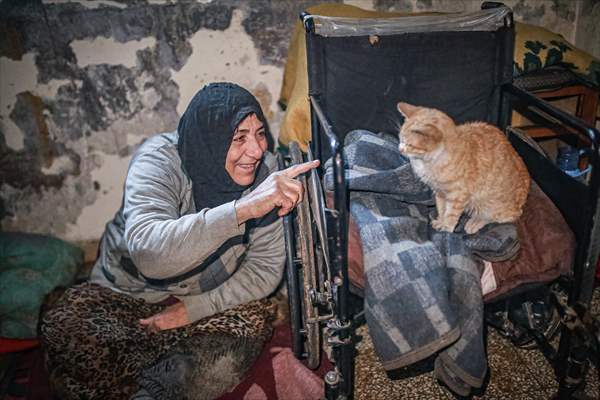 Syrian woman takes care of her cats despite difficult conditions in Idlib