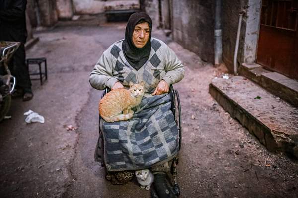 Syrian woman takes care of her cats despite difficult conditions in Idlib