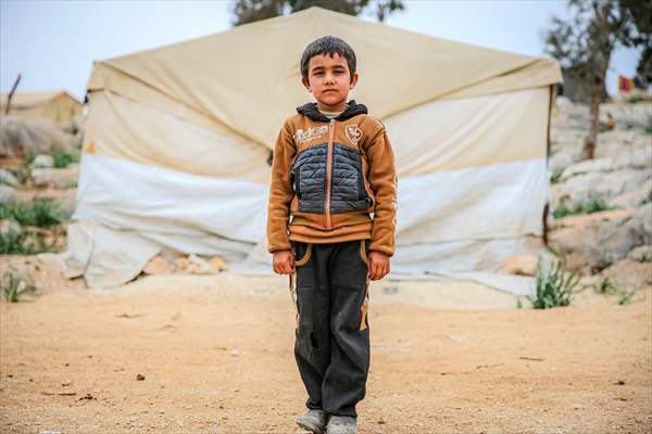 Syrian children after 12th anniversary of the Syrian Civil War at the tent city in Idlib