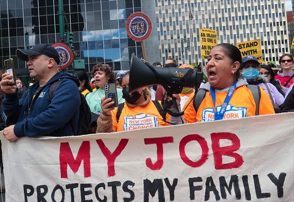 Workers march on May Day in New York City