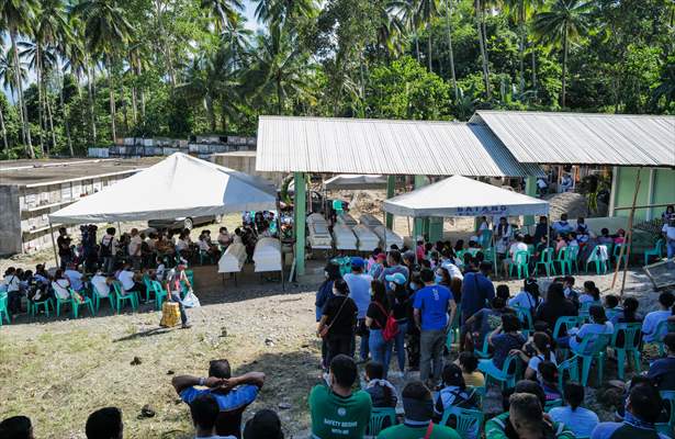Mass burial ceremony for landslide victims in Philippines