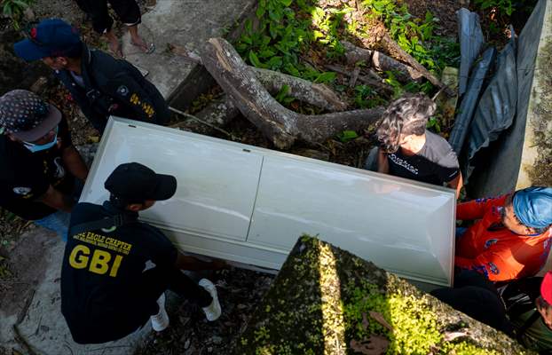 Mass burial ceremony for landslide victims in Philippines