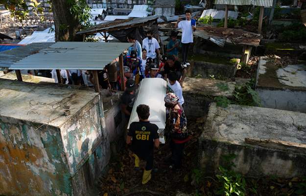 Mass burial ceremony for landslide victims in Philippines