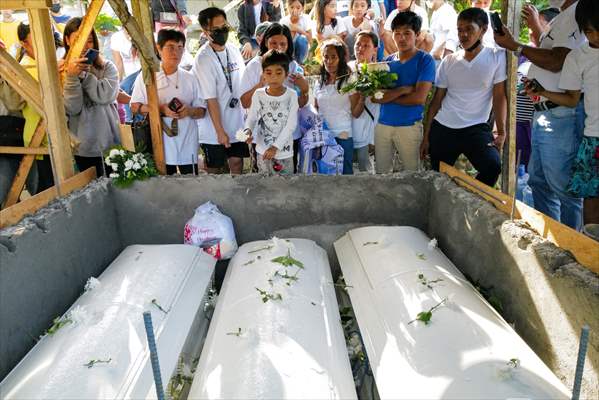 Mass burial ceremony for landslide victims in Philippines