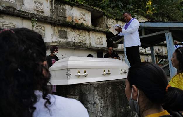 Mass burial ceremony for landslide victims in Philippines