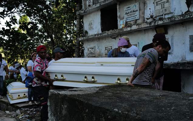 Mass burial ceremony for landslide victims in Philippines