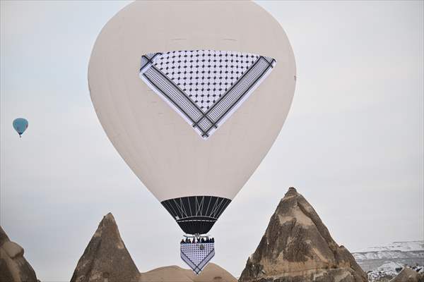 Hot air balloons with 'Palestinian keffiyeh' pattern rise above Cappadocia