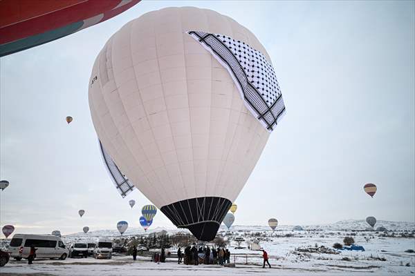 Hot air balloons with 'Palestinian keffiyeh' pattern rise above Cappadocia