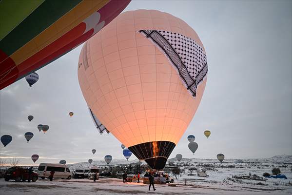 Hot air balloons with 'Palestinian keffiyeh' pattern rise above Cappadocia