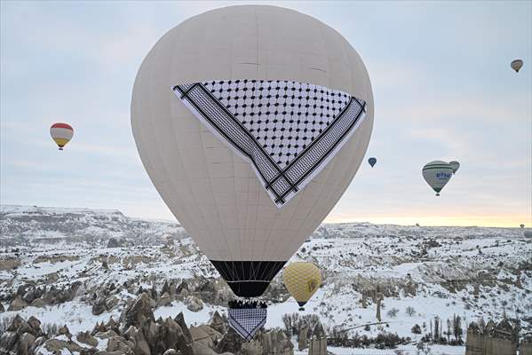 Hot air balloons with 'Palestinian keffiyeh' pattern rise above Cappadocia