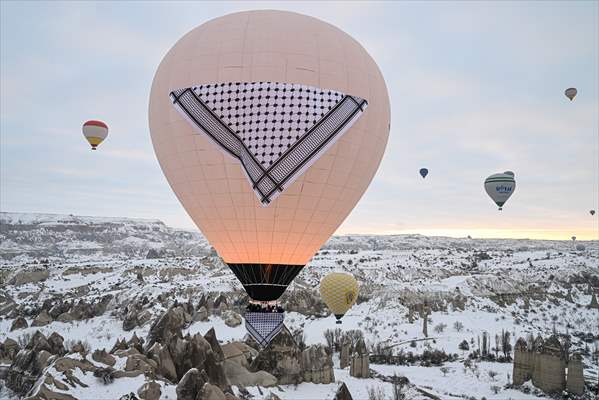 Hot air balloons with 'Palestinian keffiyeh' pattern rise above Cappadocia