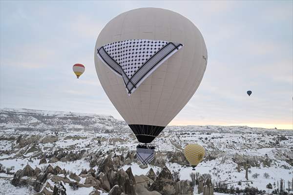 Hot air balloons with 'Palestinian keffiyeh' pattern rise above Cappadocia