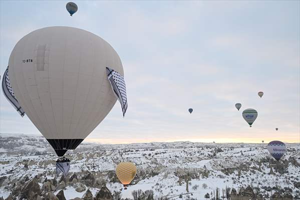 Hot air balloons with 'Palestinian keffiyeh' pattern rise above Cappadocia