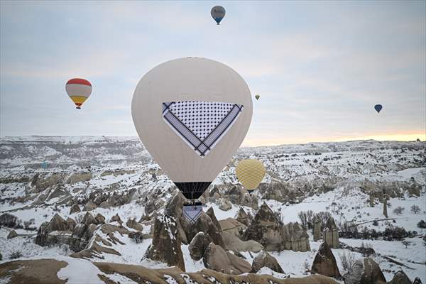 Hot air balloons with 'Palestinian keffiyeh' pattern rise above Cappadocia