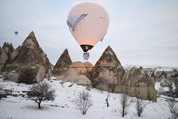 Hot air balloons with 'Palestinian keffiyeh' pattern rise above Cappadocia