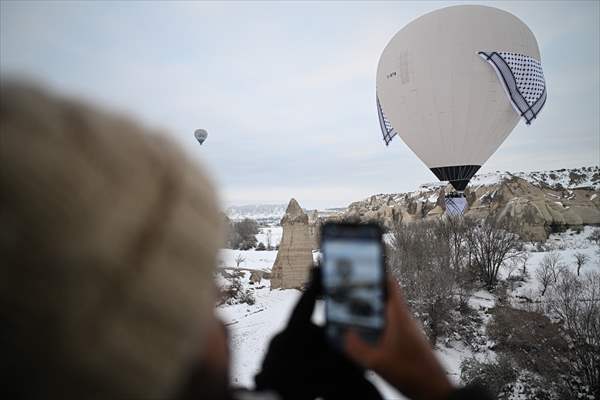 Hot air balloons with 'Palestinian keffiyeh' pattern rise above Cappadocia