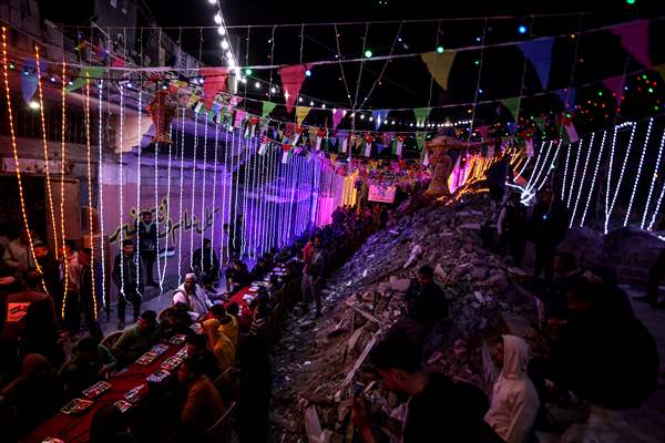 First sahur meal among the collapsed houses in Khan Yunis