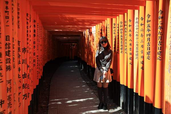 Fushimi Inari Shrine in Kyoto welcomes tourists and locals, reflecting daily life