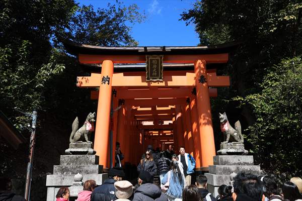 Fushimi Inari Shrine in Kyoto welcomes tourists and locals, reflecting daily life