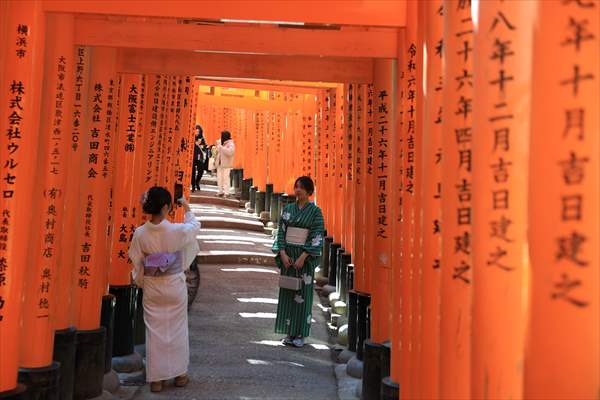 Fushimi Inari Shrine in Kyoto welcomes tourists and locals, reflecting daily life