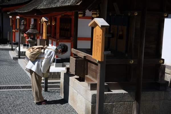 Fushimi Inari Shrine in Kyoto welcomes tourists and locals, reflecting daily life