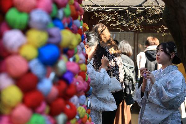 Fushimi Inari Shrine in Kyoto welcomes tourists and locals, reflecting daily life