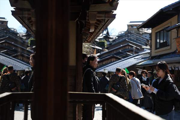 Fushimi Inari Shrine in Kyoto welcomes tourists and locals, reflecting daily life