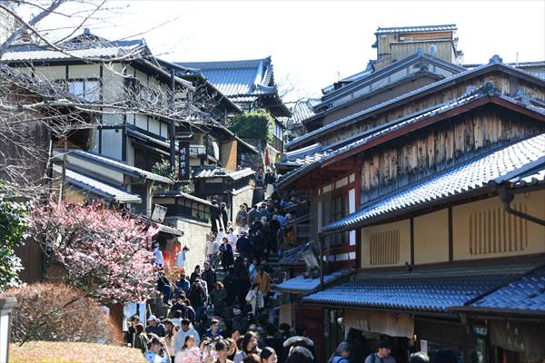 Fushimi Inari Shrine in Kyoto welcomes tourists and locals, reflecting daily life