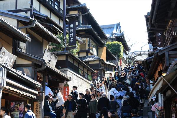 Fushimi Inari Shrine in Kyoto welcomes tourists and locals, reflecting daily life