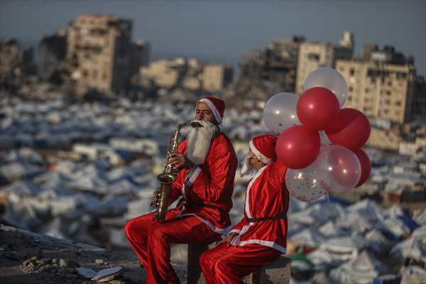 Volunteers dressed as Santa bring joy to children in Gaza