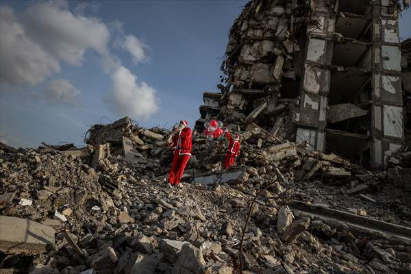 Volunteers dressed as Santa bring joy to children in Gaza