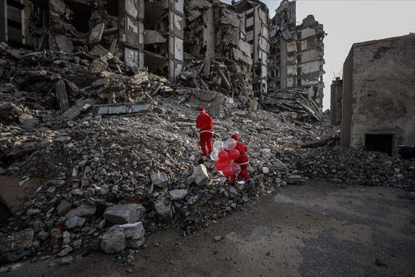Volunteers dressed as Santa bring joy to children in Gaza
