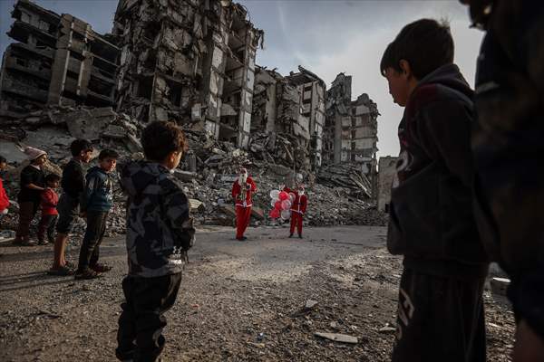 Volunteers dressed as Santa bring joy to children in Gaza