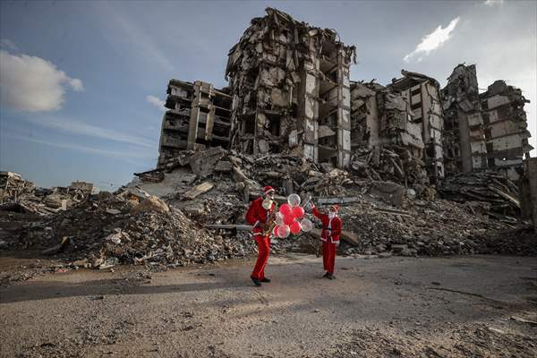 Volunteers dressed as Santa bring joy to children in Gaza