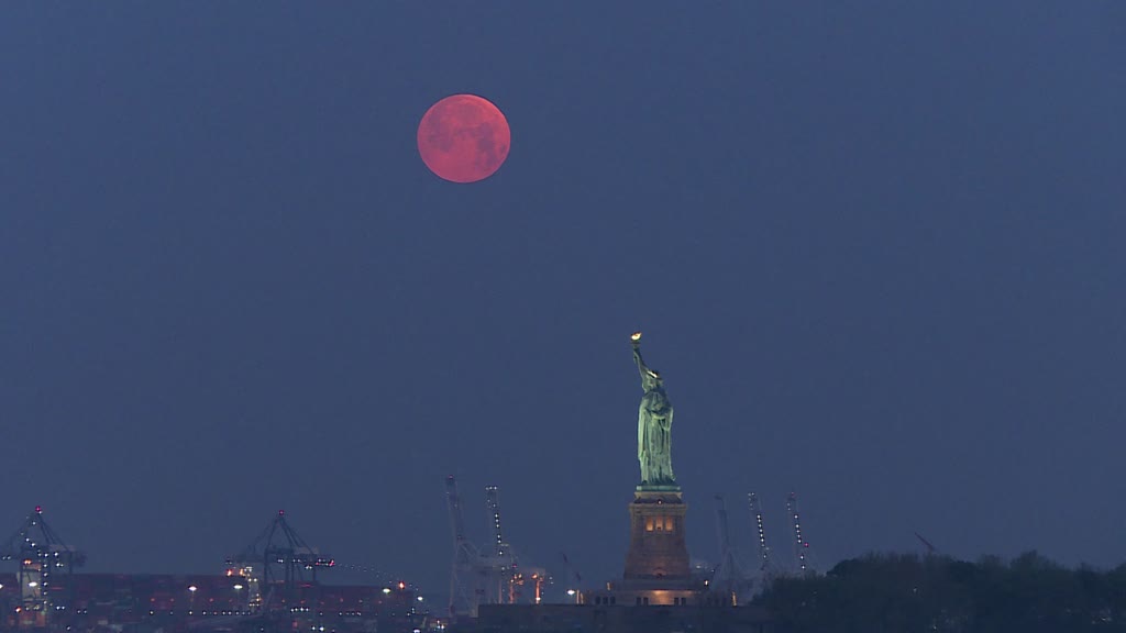 'Super Flower Blood Moon' eclipse over Statue of Liberty in New York
