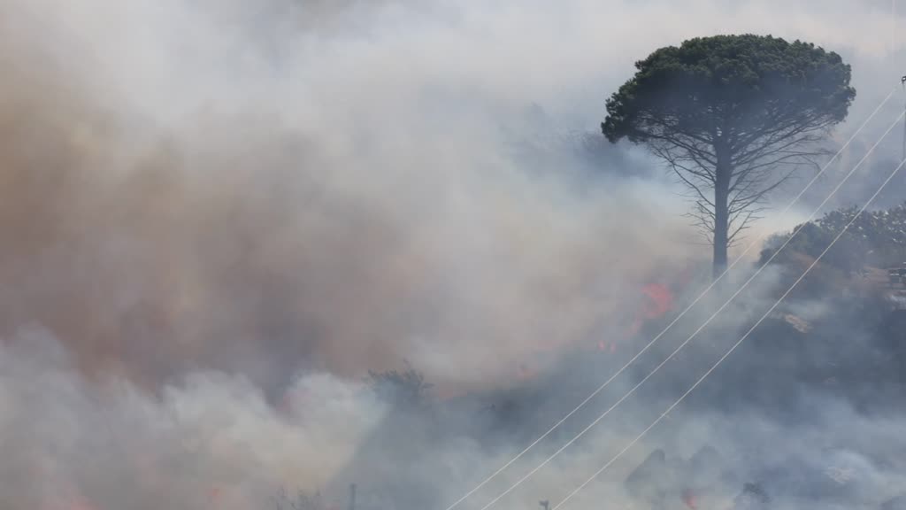 ITALY: Wildfires ravage southern Sicily, threatening homes