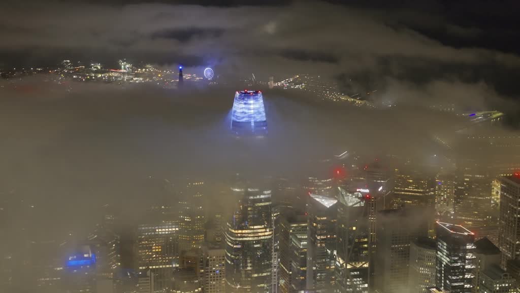 Mesmerizing drone footage of San Francisco night view in fog