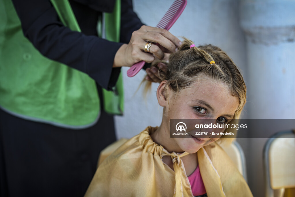 Volunteer hairdressers in Jarabulus cheer the Orphan girls