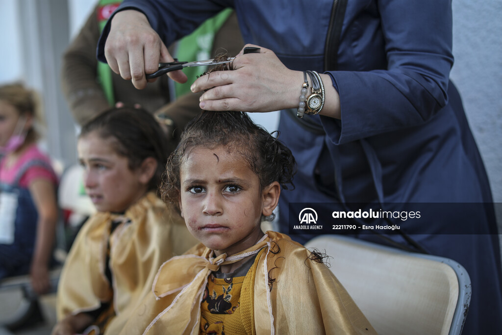 Volunteer hairdressers in Jarabulus cheer the Orphan girls