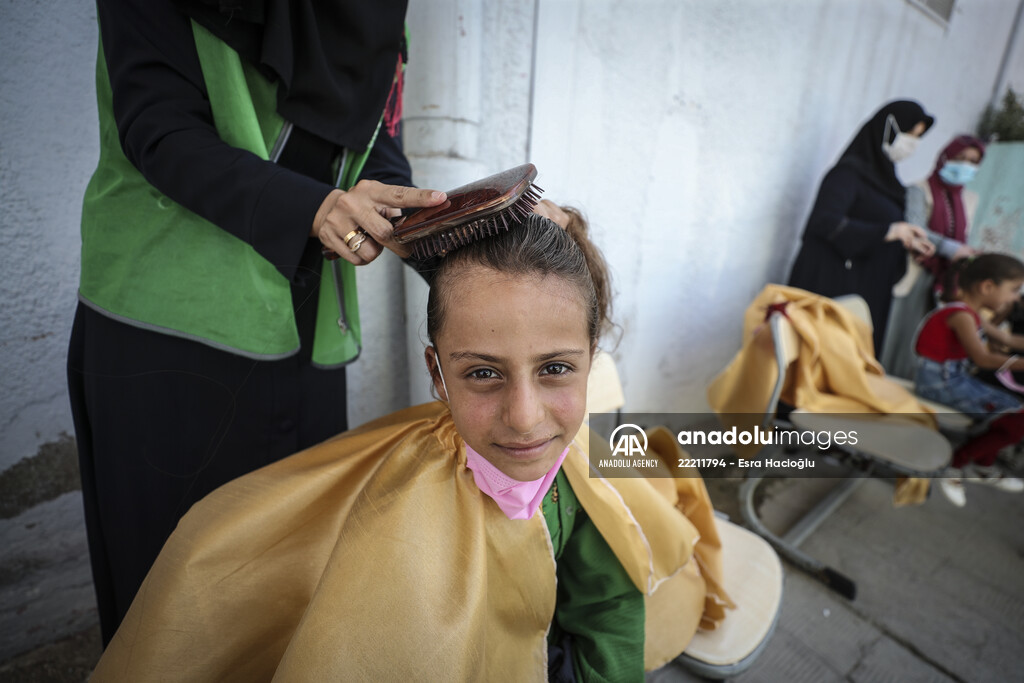 Volunteer hairdressers in Jarabulus cheer the Orphan girls