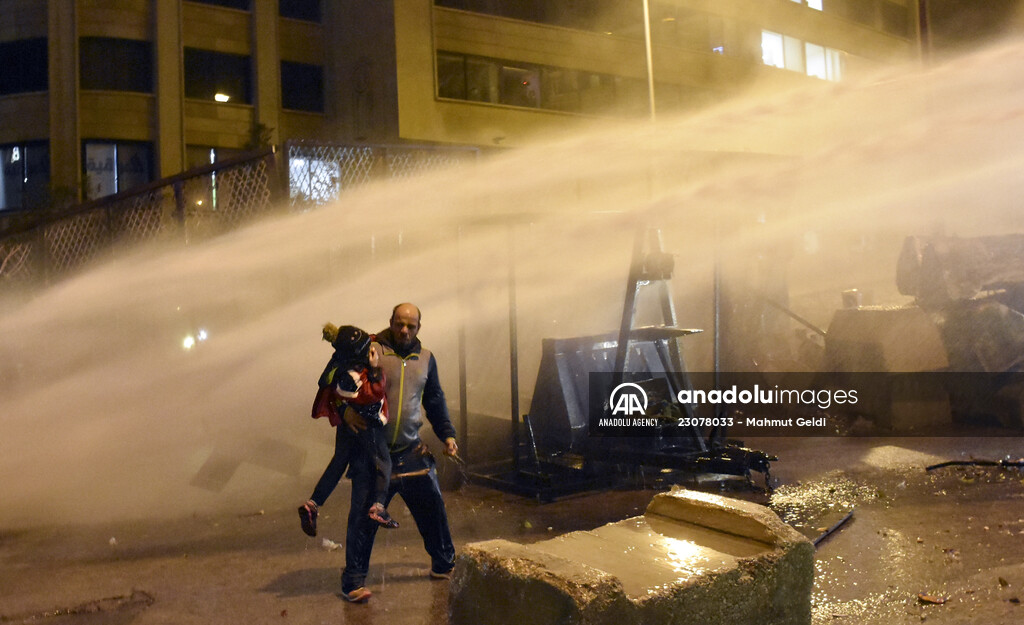 Father and son amid a police intervention