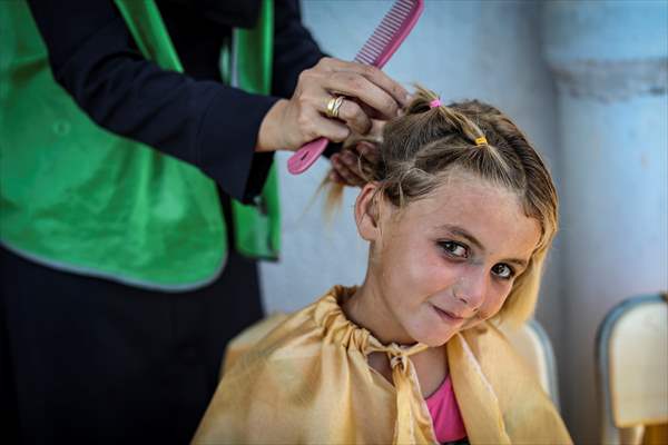 Volunteer hairdressers in Jarabulus cheer the Orphan girls